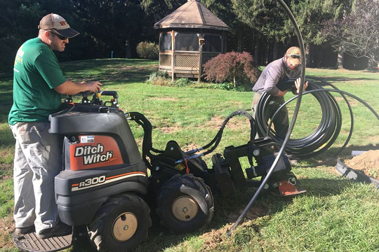 BML crew installing a new irrigation system with a vibratory plow